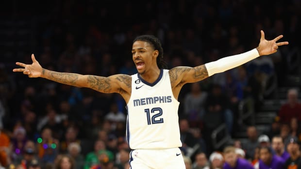 Grizzlies guard Ja Morant celebrates a shot during a game.